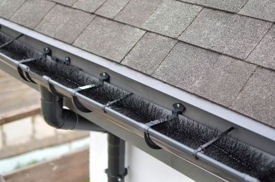 Property Before and After Gutter Cover Installation